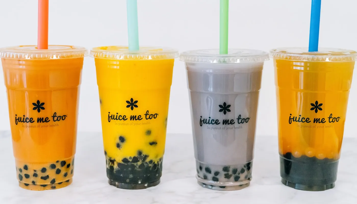 Boba drinks lined up on a counter